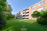 Gartenansicht - Nahe Tibarg: Vermietete 2,5-Zimmer-Wohnung mit Süd-West-Loggia und idyllischem Ausblick!
