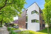 Außenansicht - Großzügig wohnen: Neubauwohnung auf zwei Ebenen mit eigenem Garten!